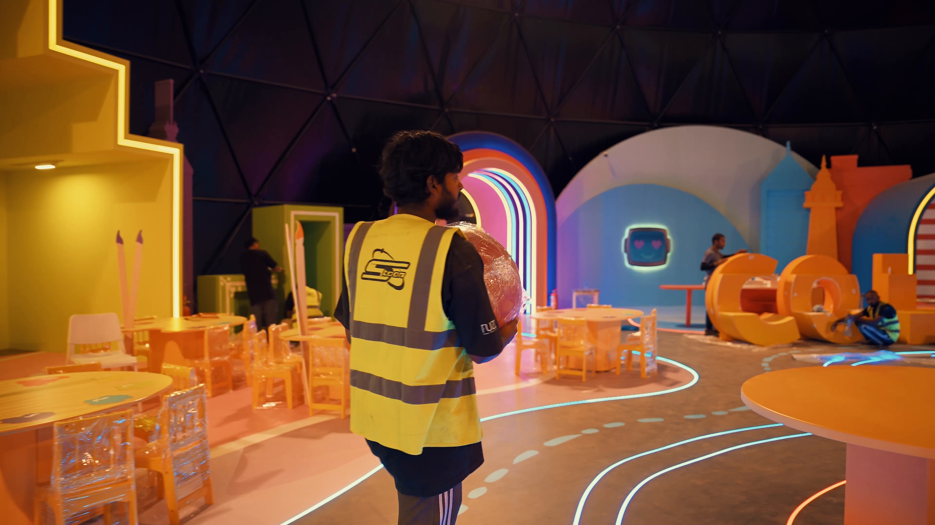 Crew member walking through the finished colour room