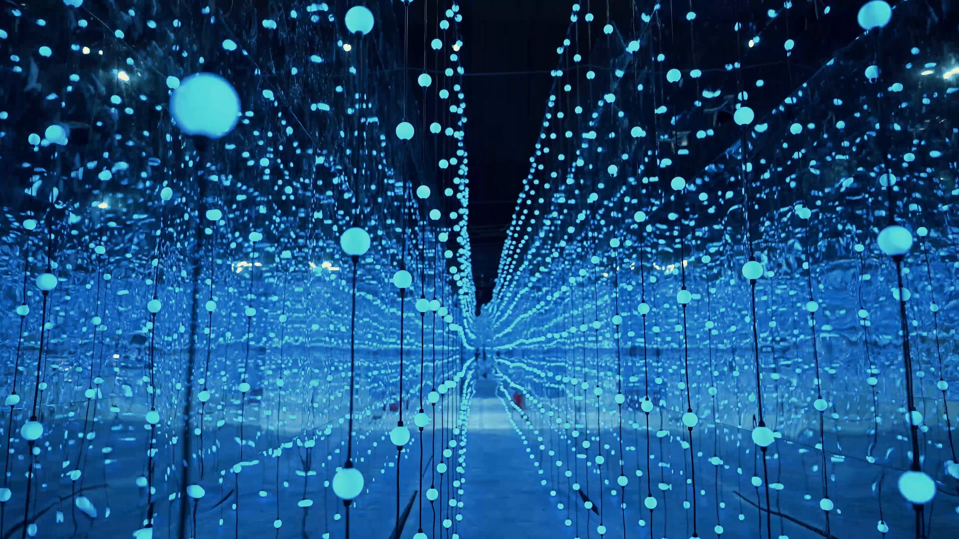 Infinity-light corridor of hanging points of blue light
