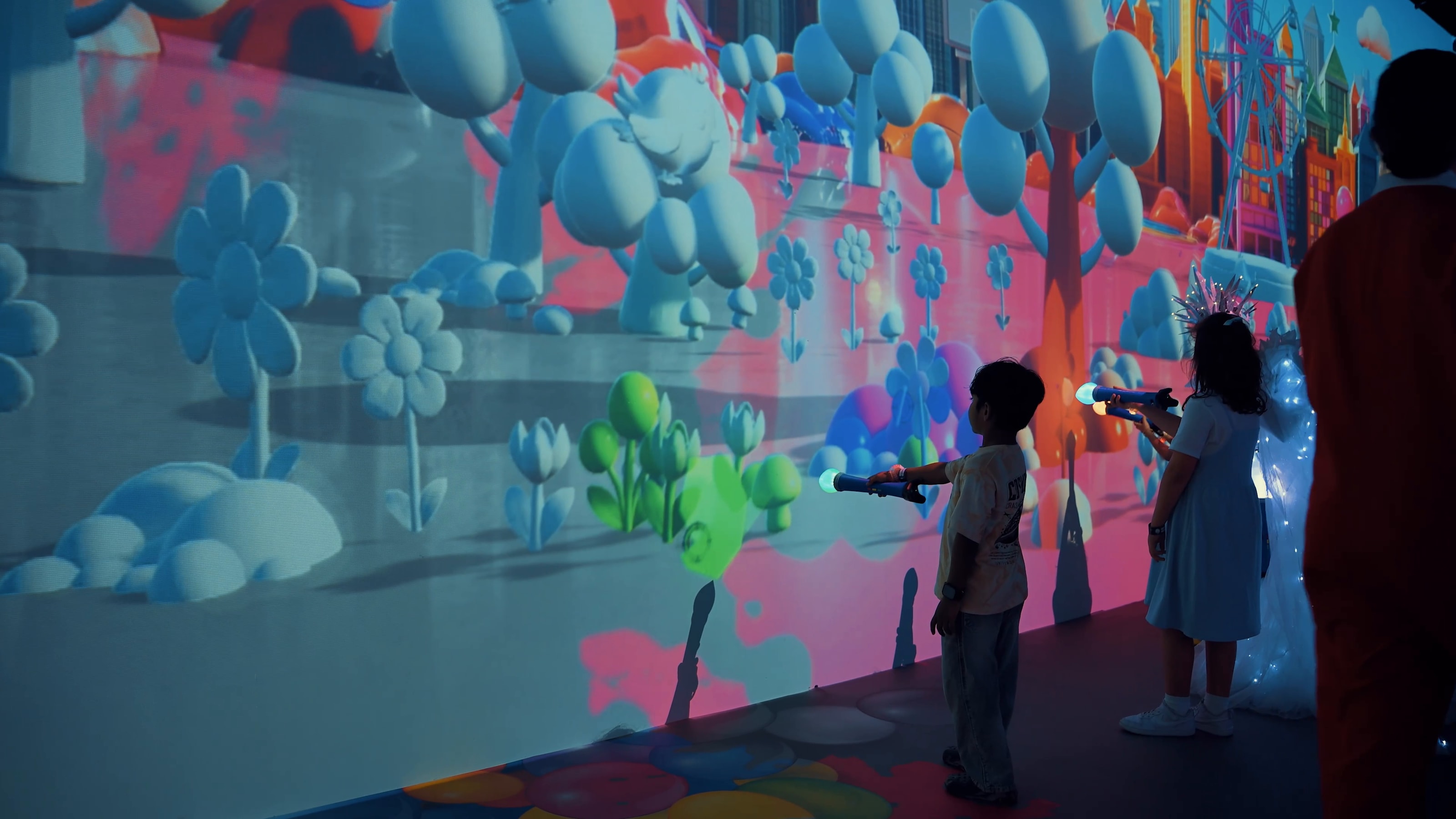 Children interacting with a bright projected world