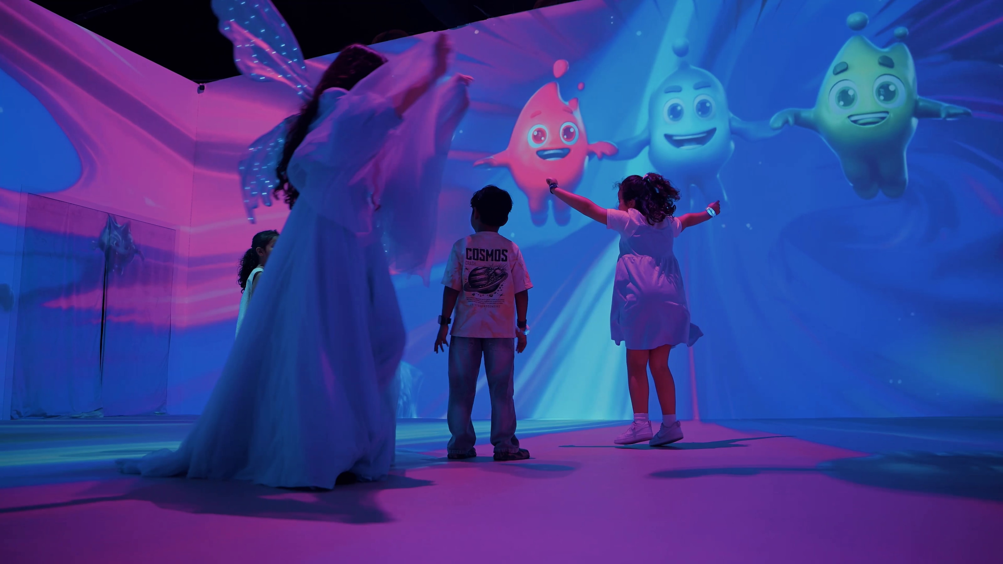 Full-room projection with a performer and children