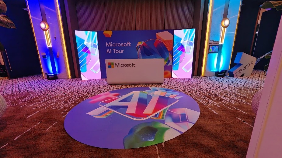 AI floor graphic in front of Microsoft AI Tour signage