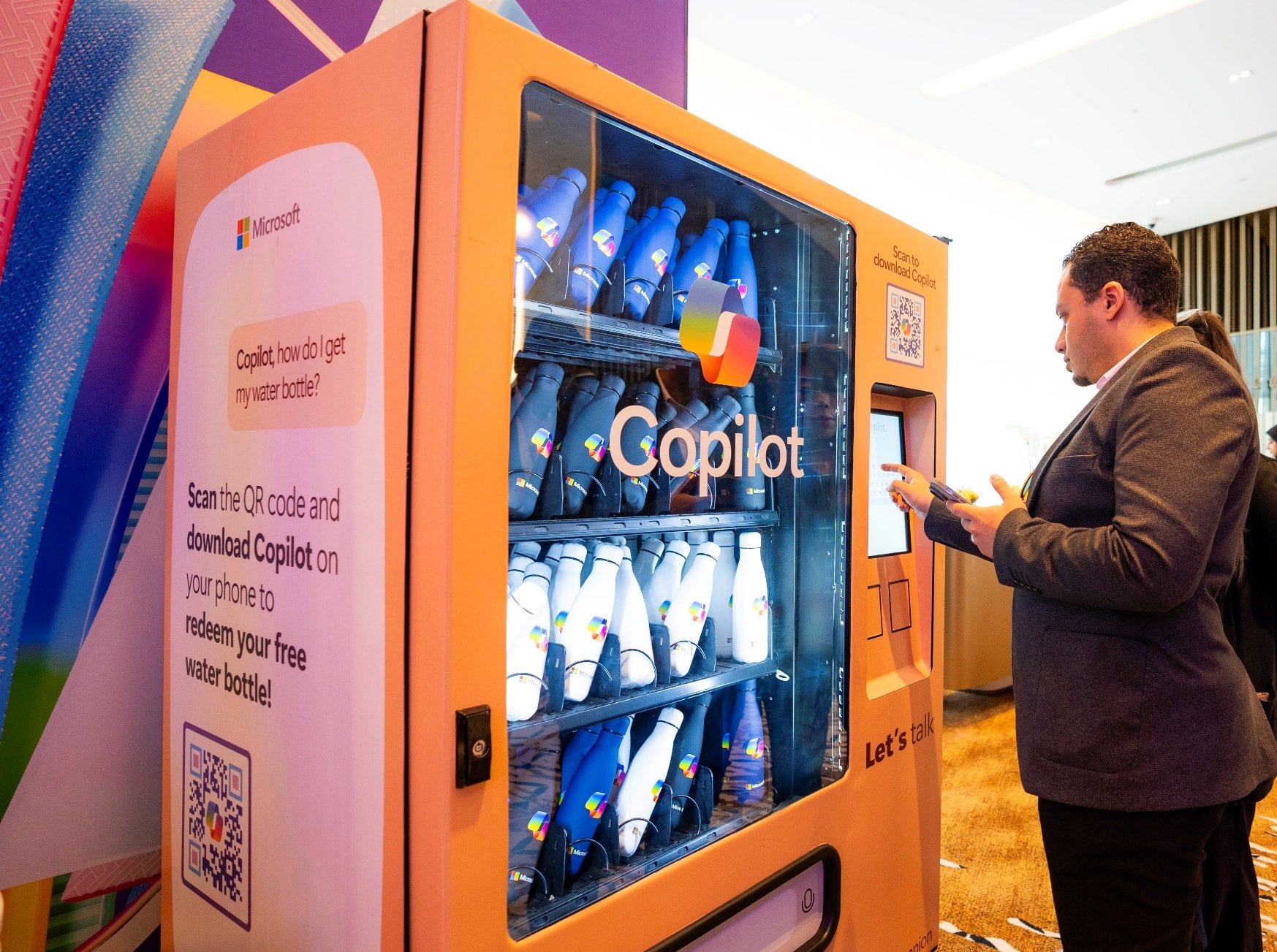Guest using a Copilot-branded vending machine