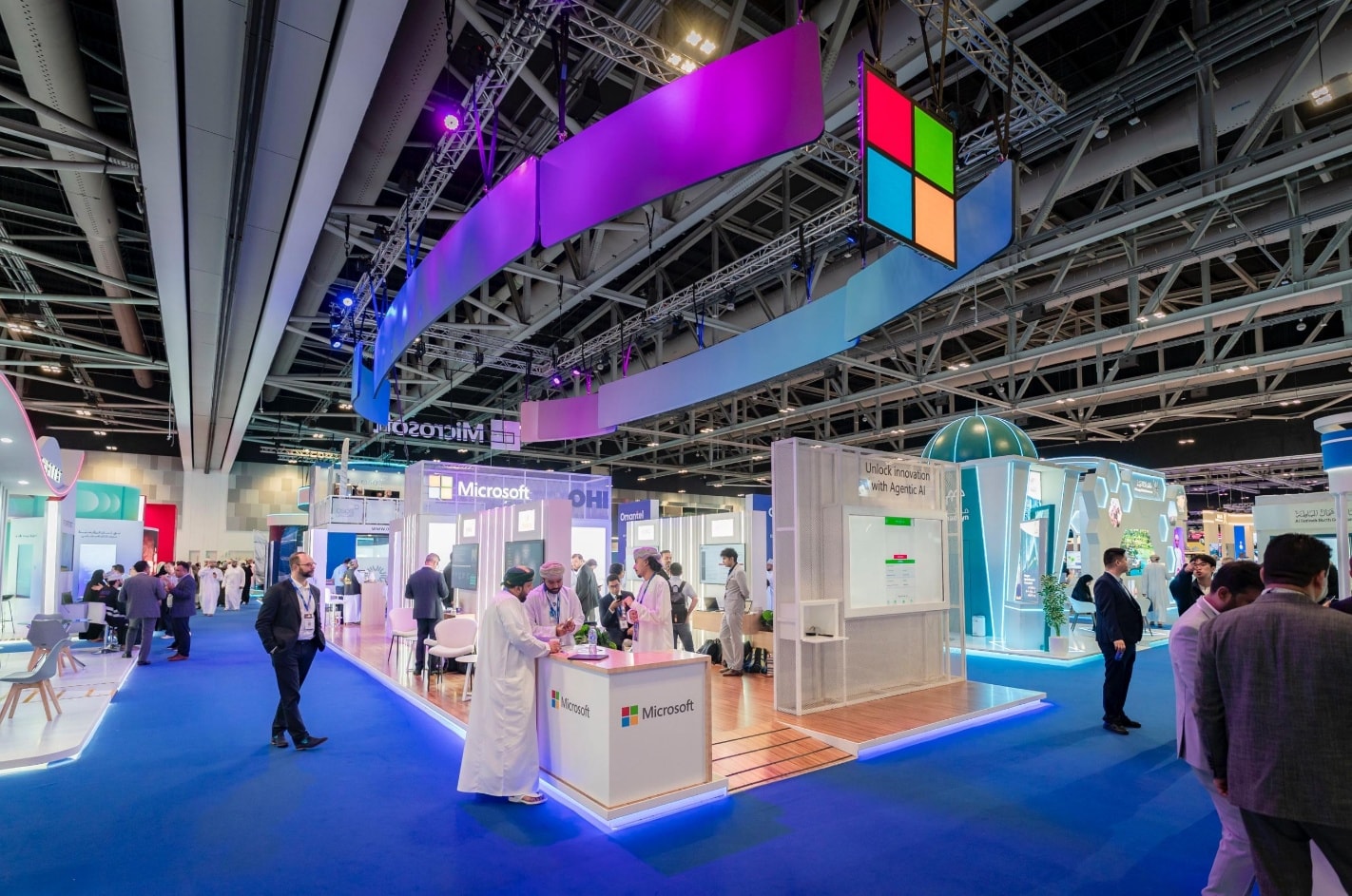 Sweeping canopy with the Microsoft logo above the booth