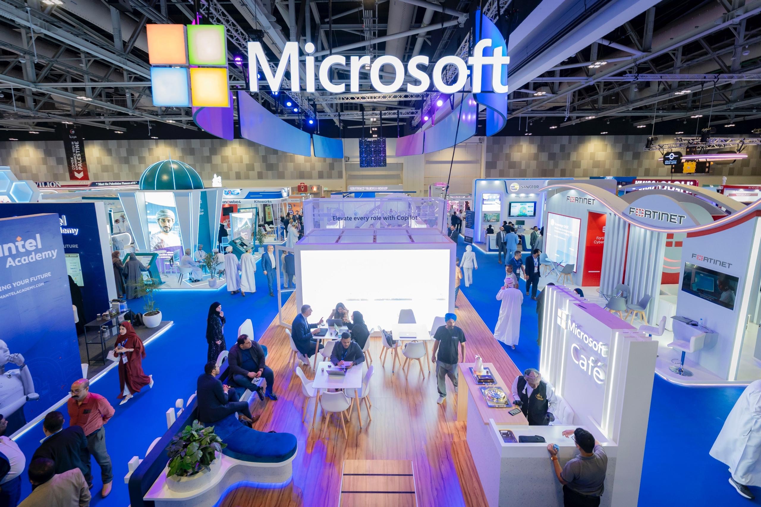Microsoft booth at COMEX Oman with a large illuminated logo