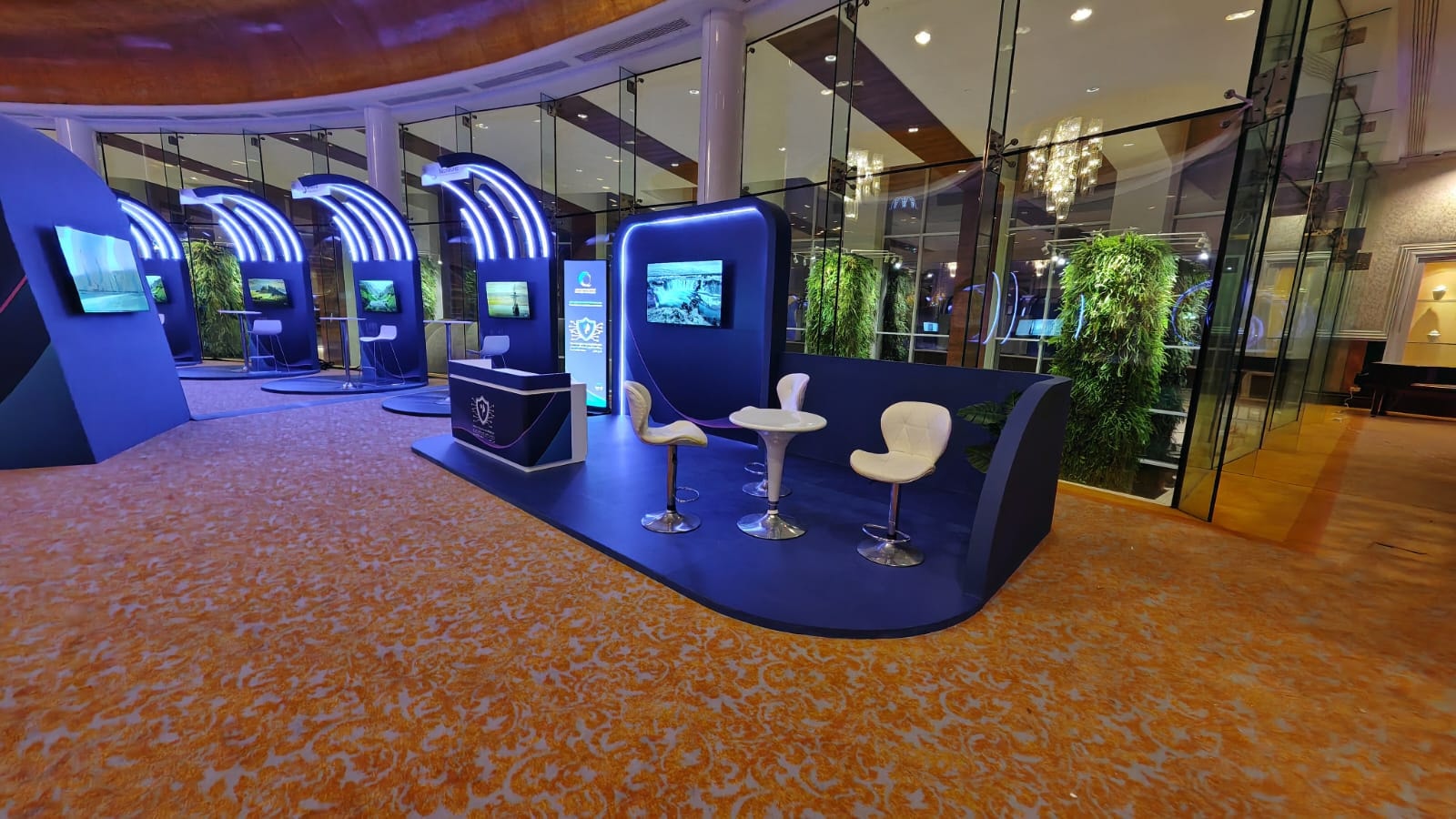 Exhibition pods with screens and high tables