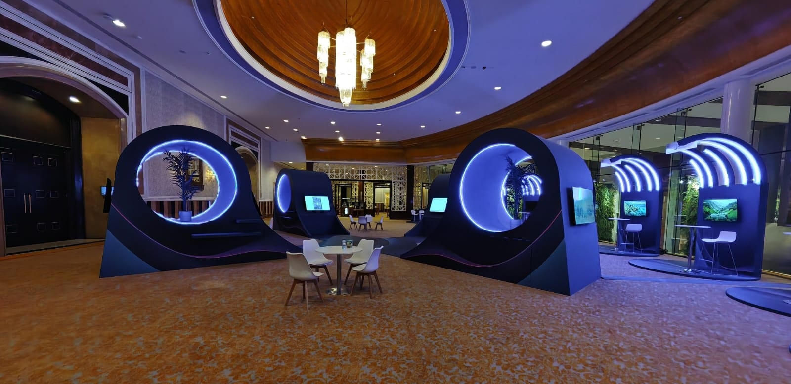 Circular illuminated pods in a domed hall