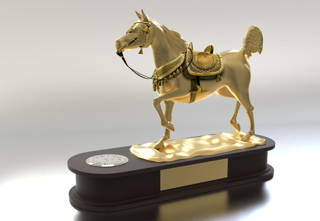 Gold Arabian horse trophy on a black oval base