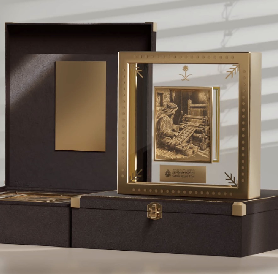 Framed gold artwork in a dark presentation box