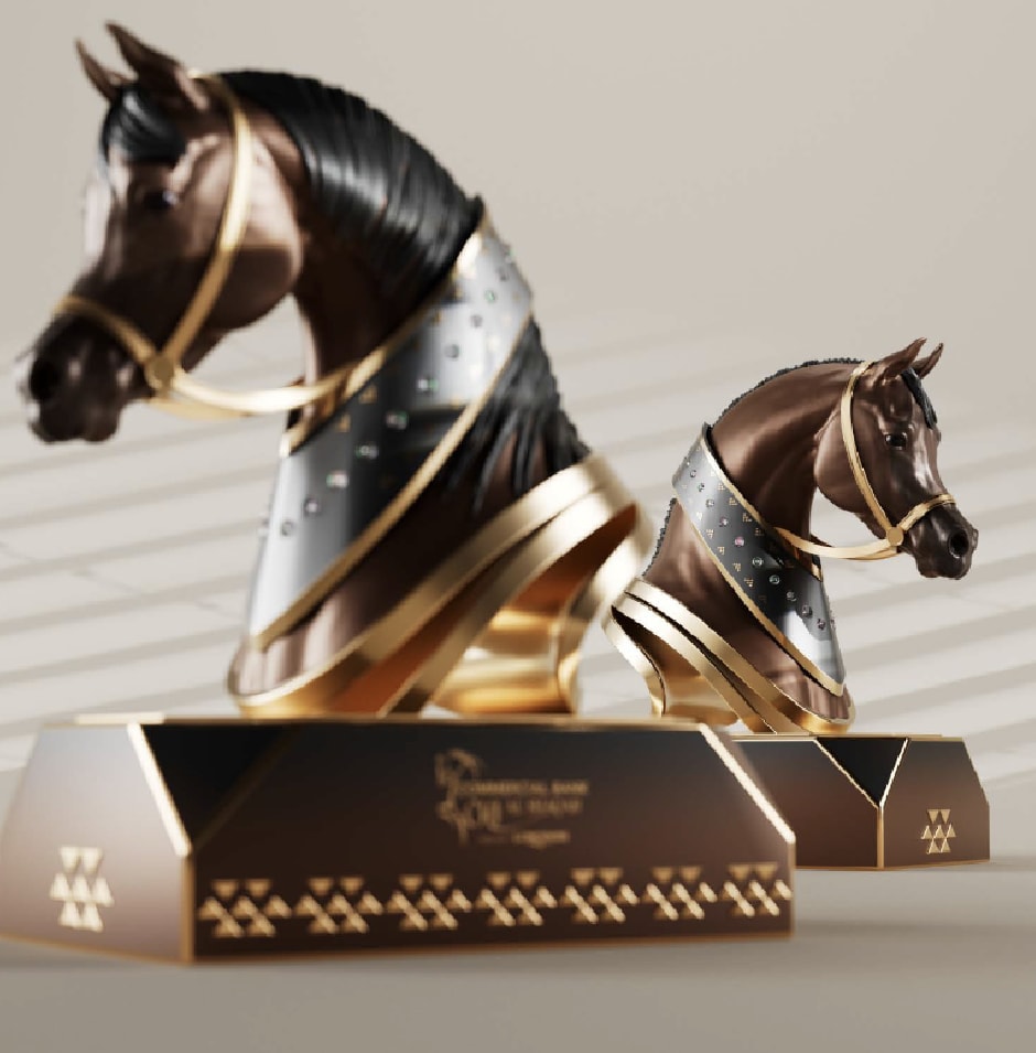 Bronze and black horse-head sculpture on an engraved base