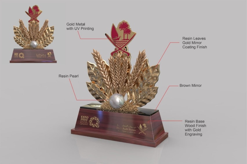 Palm-leaf award with gold and maroon finishes