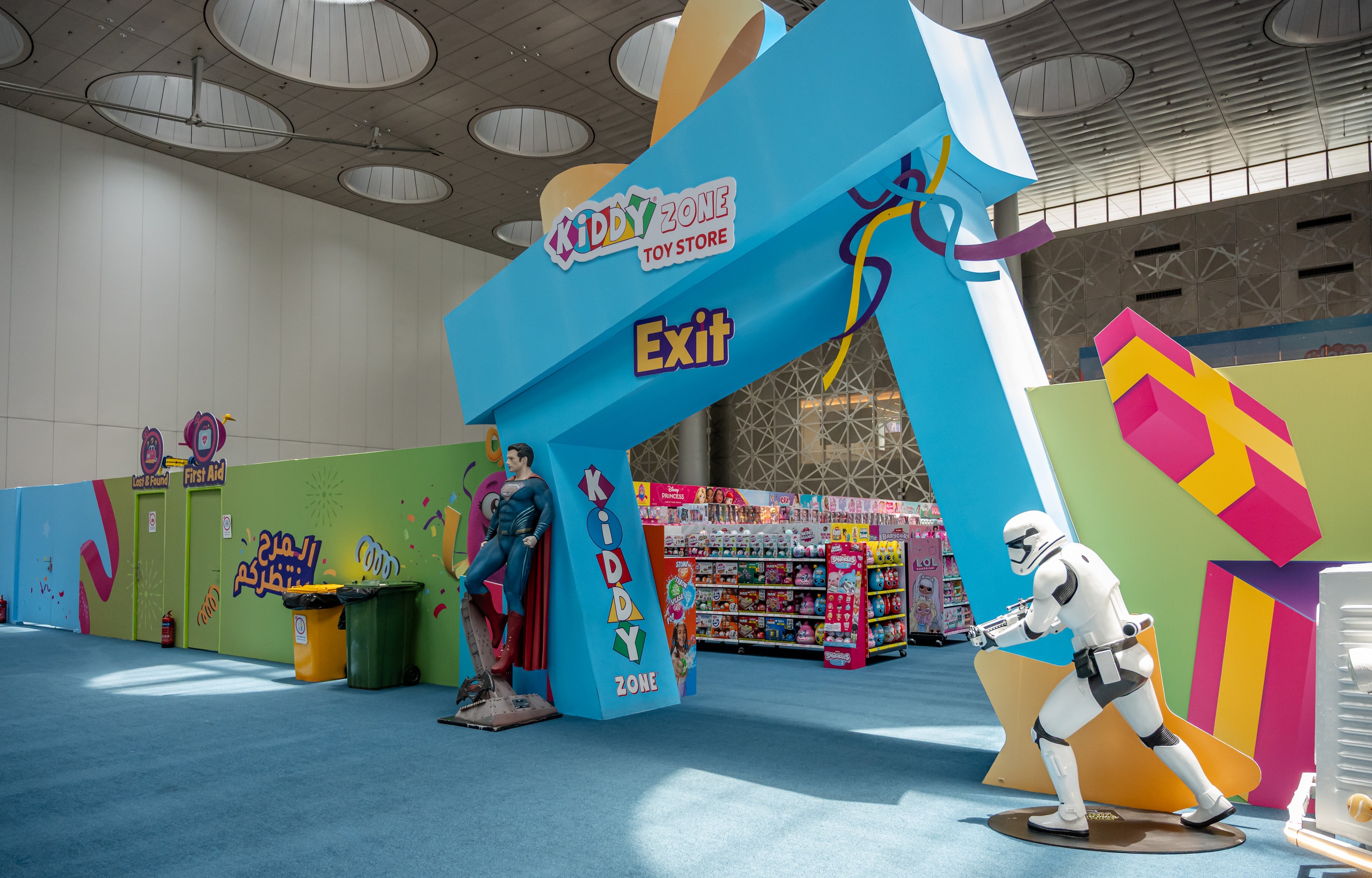Exit gate framed by superhero figures