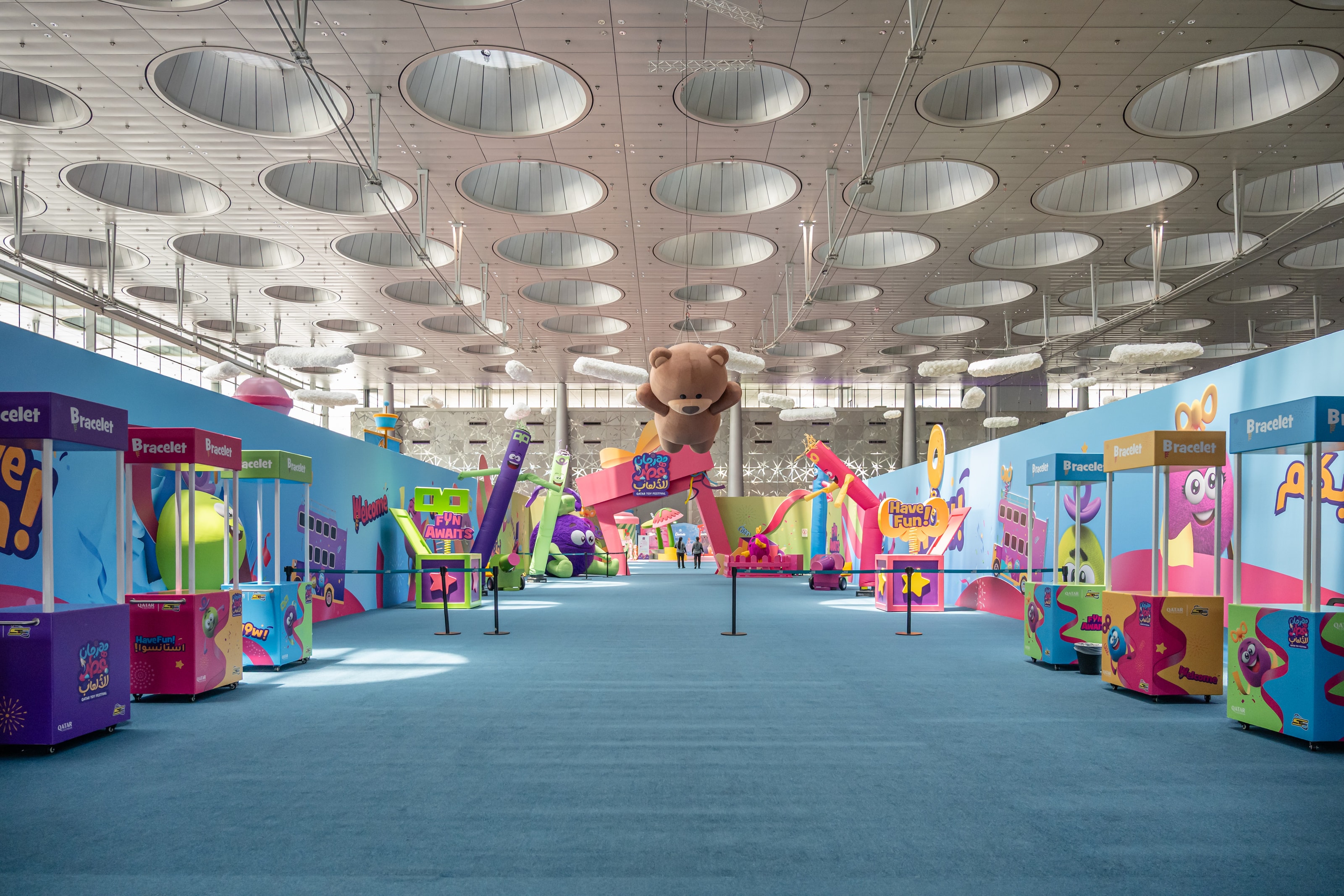 Games midway with candy-coloured booths