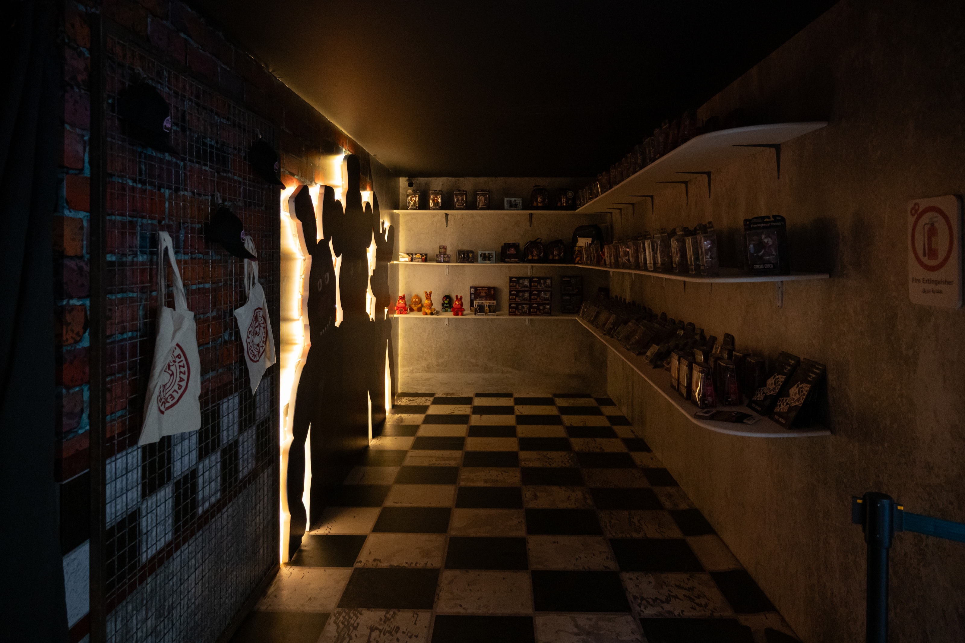 Checkerboard corridor with backlit silhouettes