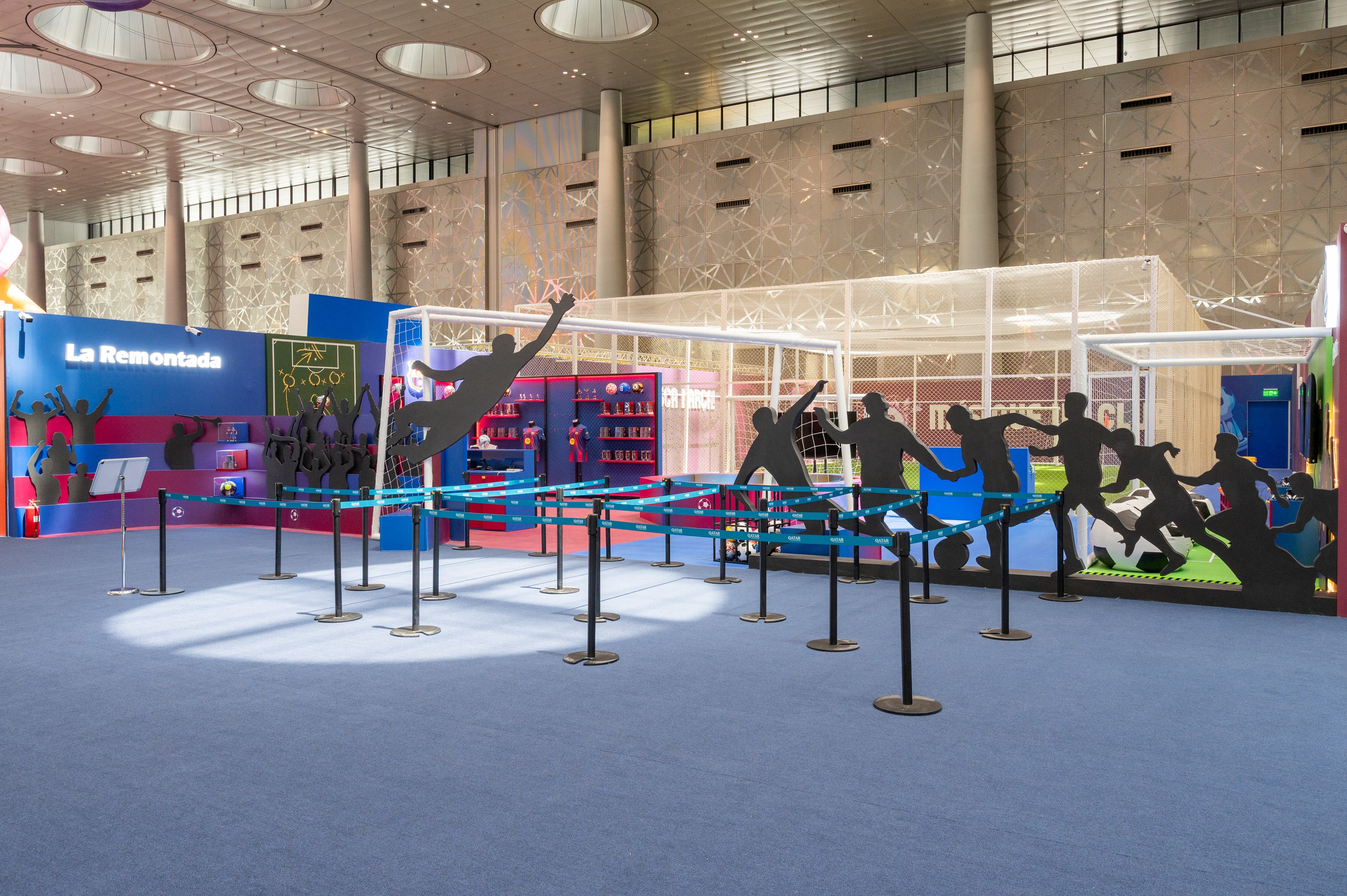 Barça zone with player silhouettes leaping above the queue line