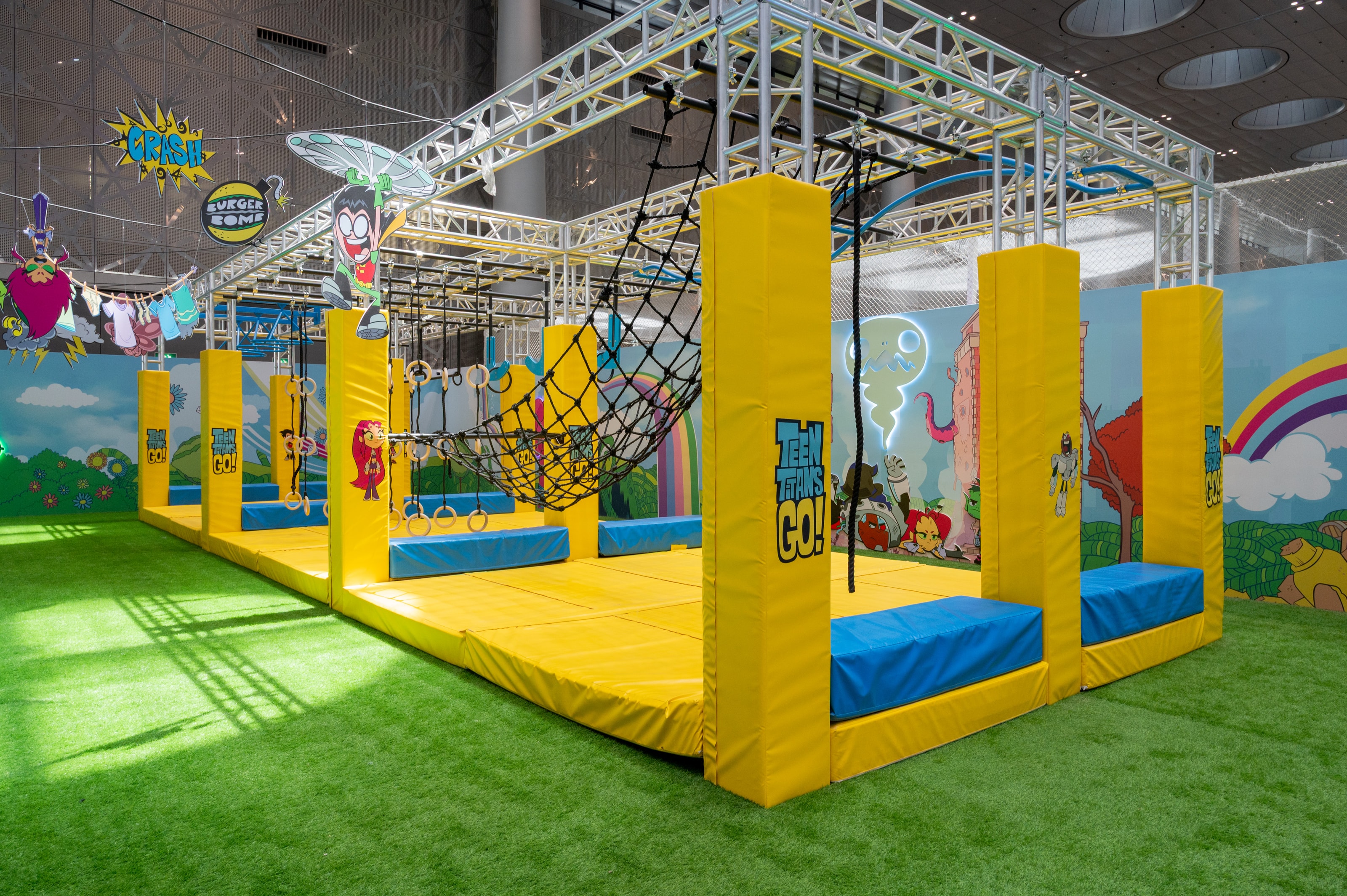 Wide view of the ninja course rigging and padded obstacles