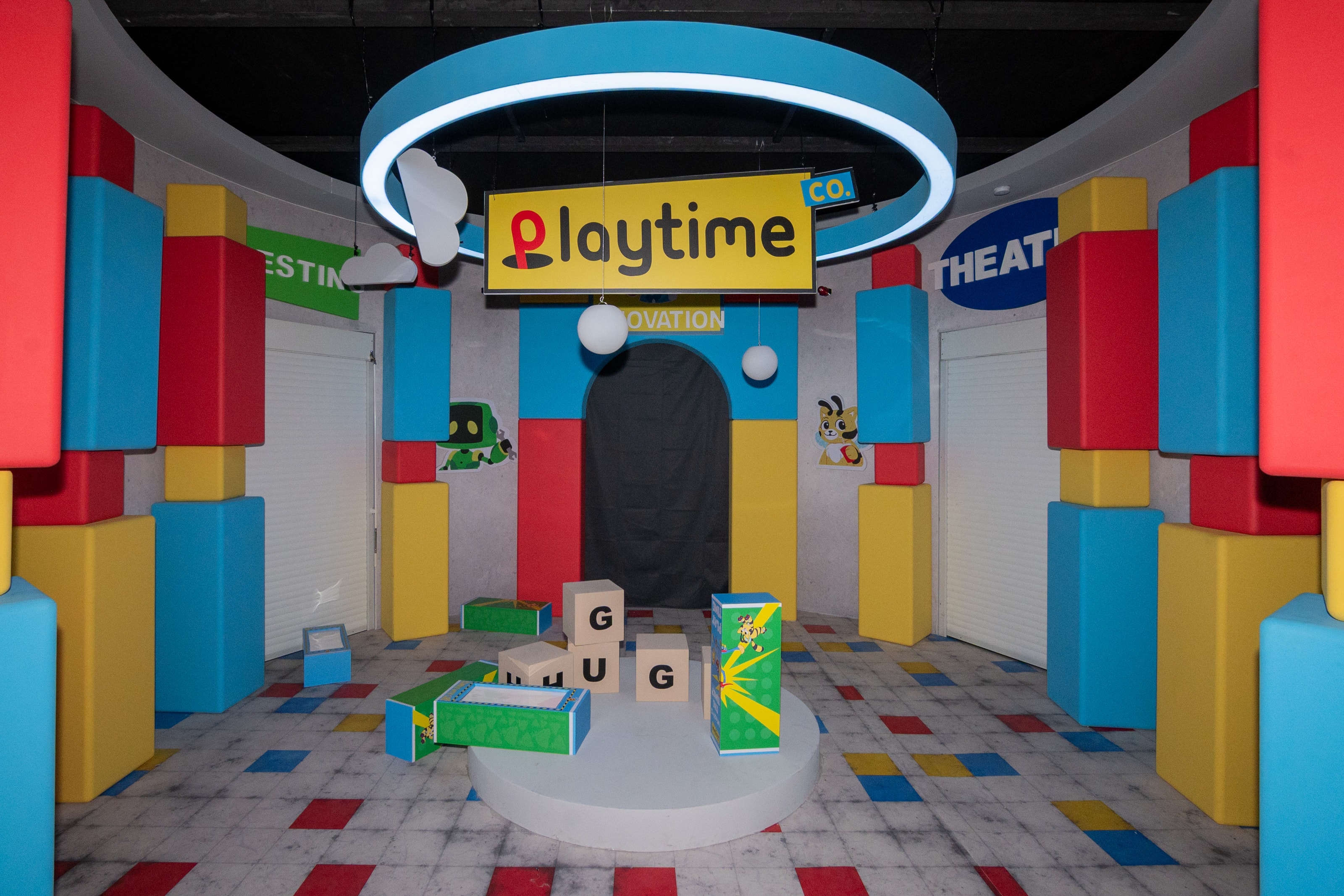 Playtime room with blue halo light and primary-colour block walls