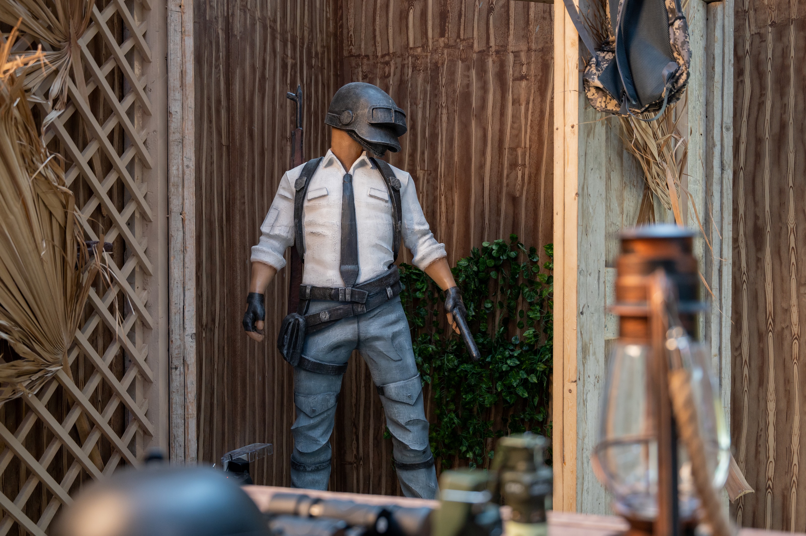 Life-size PUBG character figure in a level-three helmet