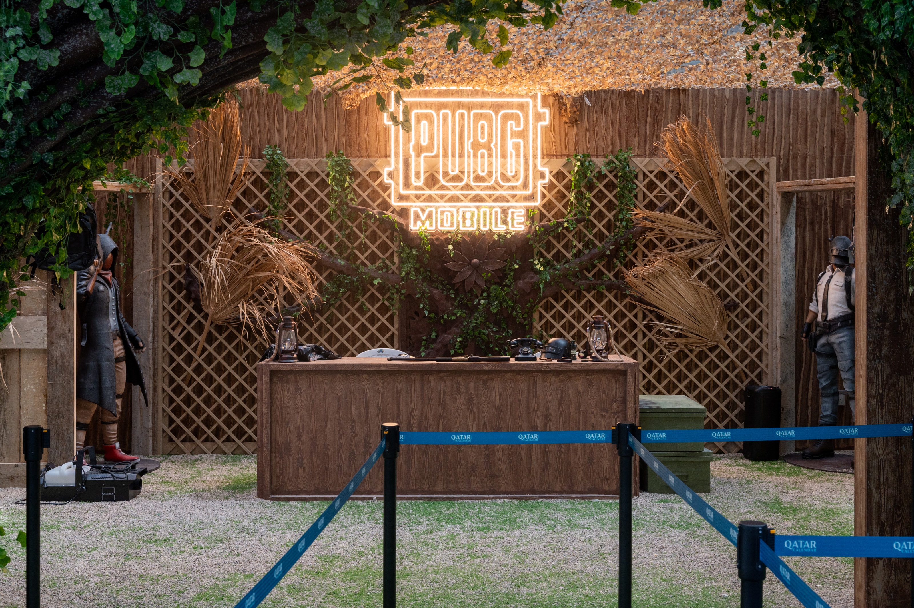Wooden loot counter beneath a PUBG neon sign