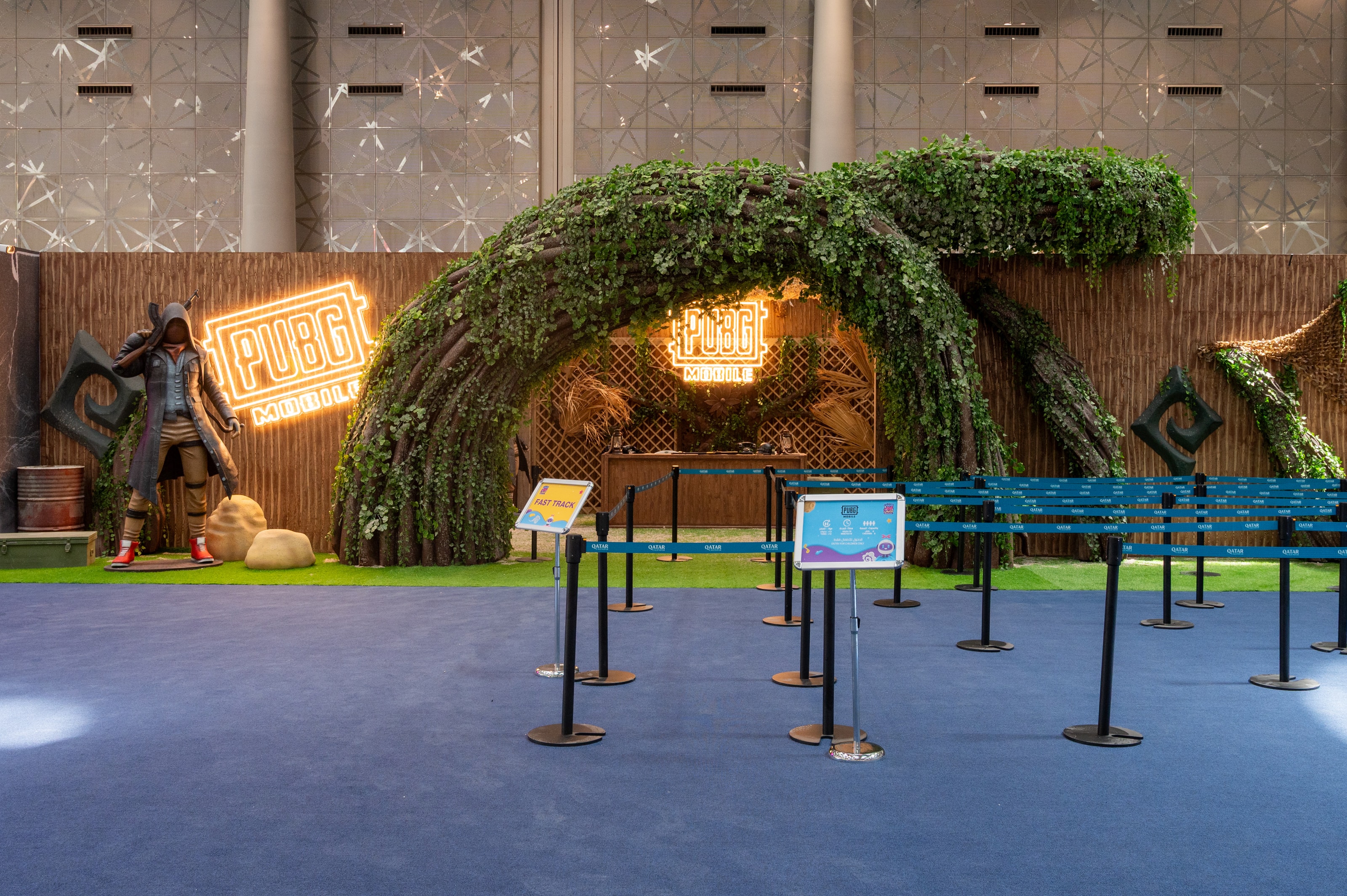 Queue lines leading to the PUBG Mobile zone and its ivy arch