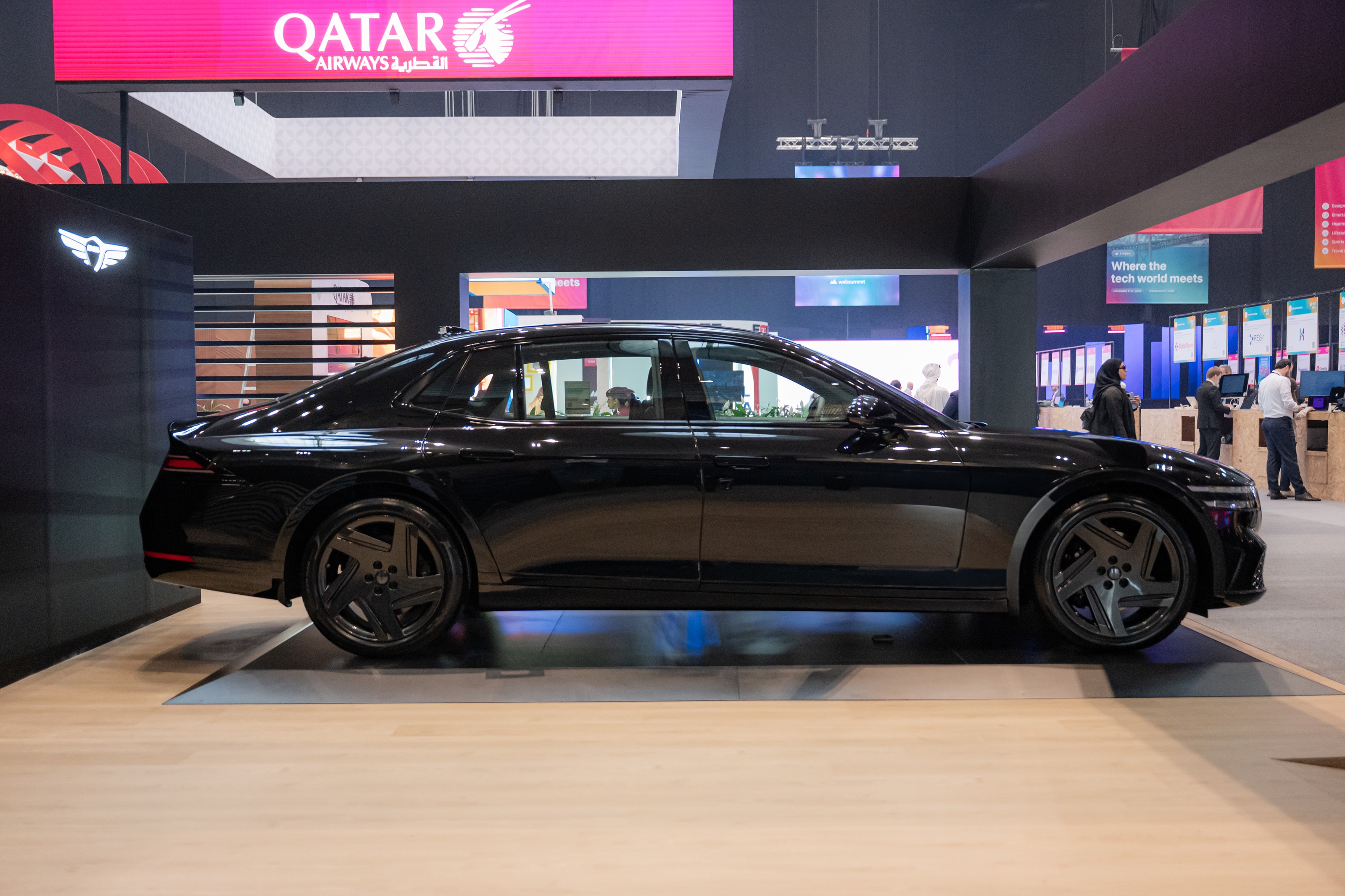 Genesis G90 in profile under the canopy