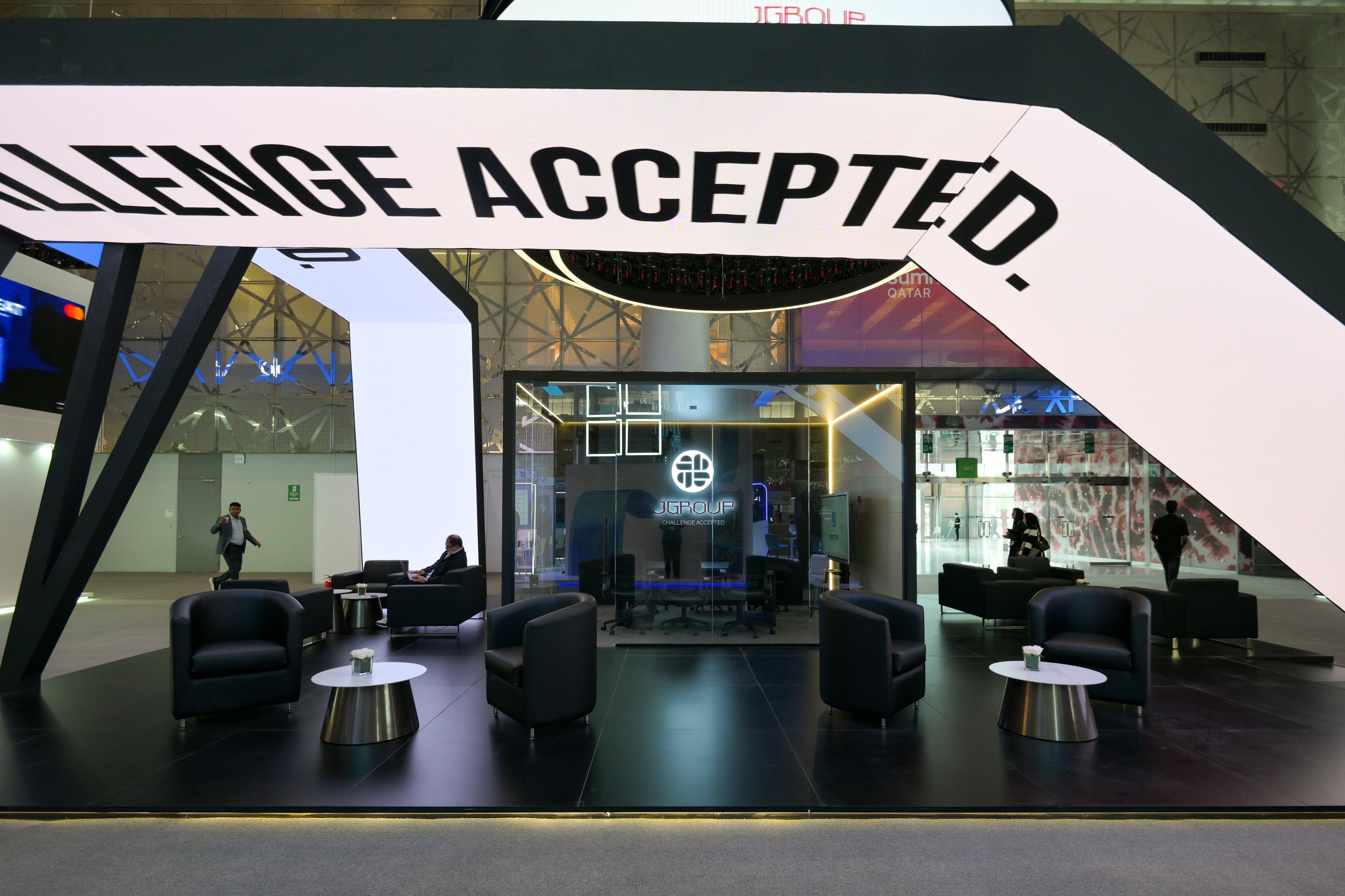 Wide view of the J Group lounge under the light-box blade