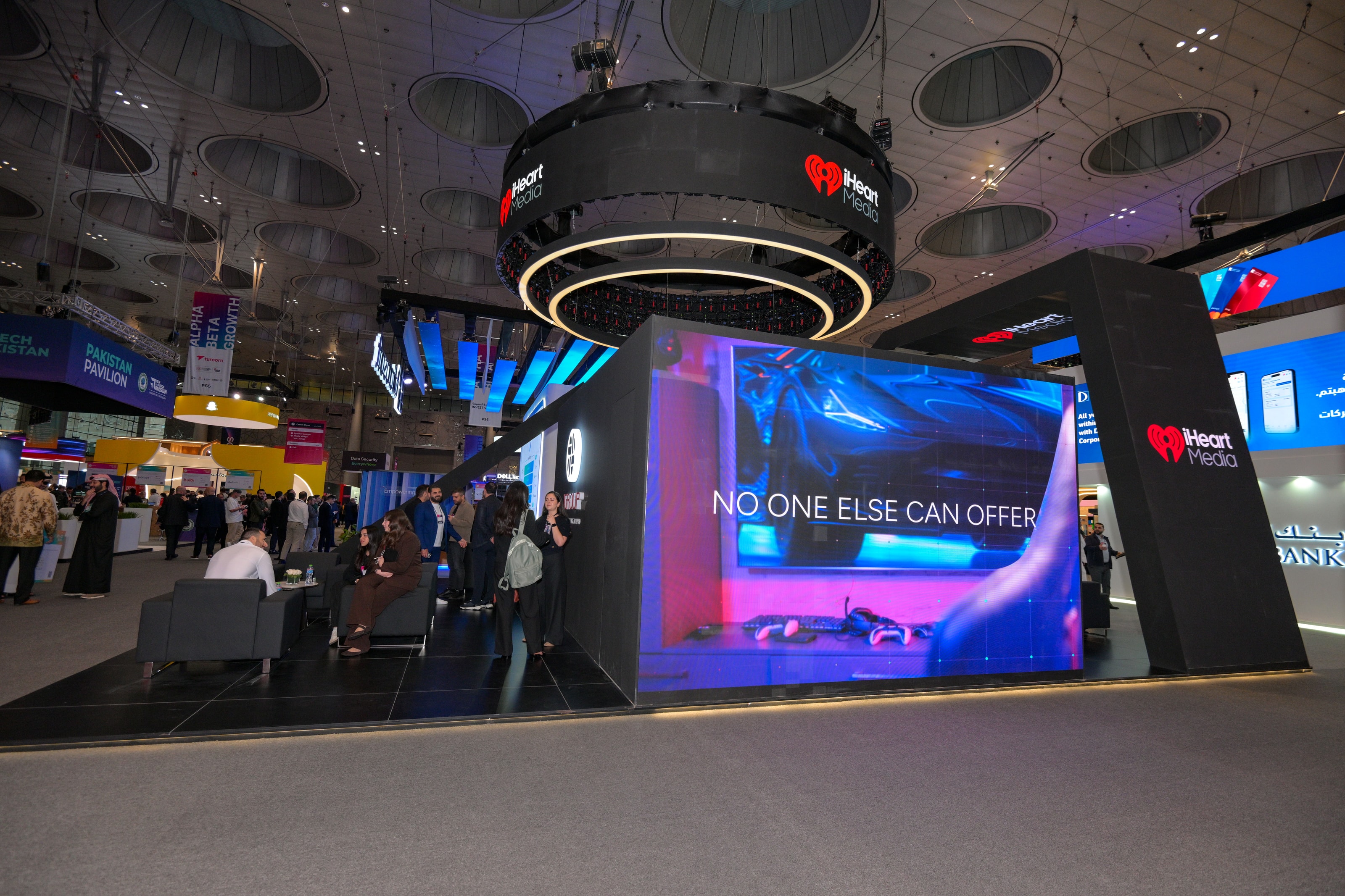 J Group stand with a large LED screen facing the aisle