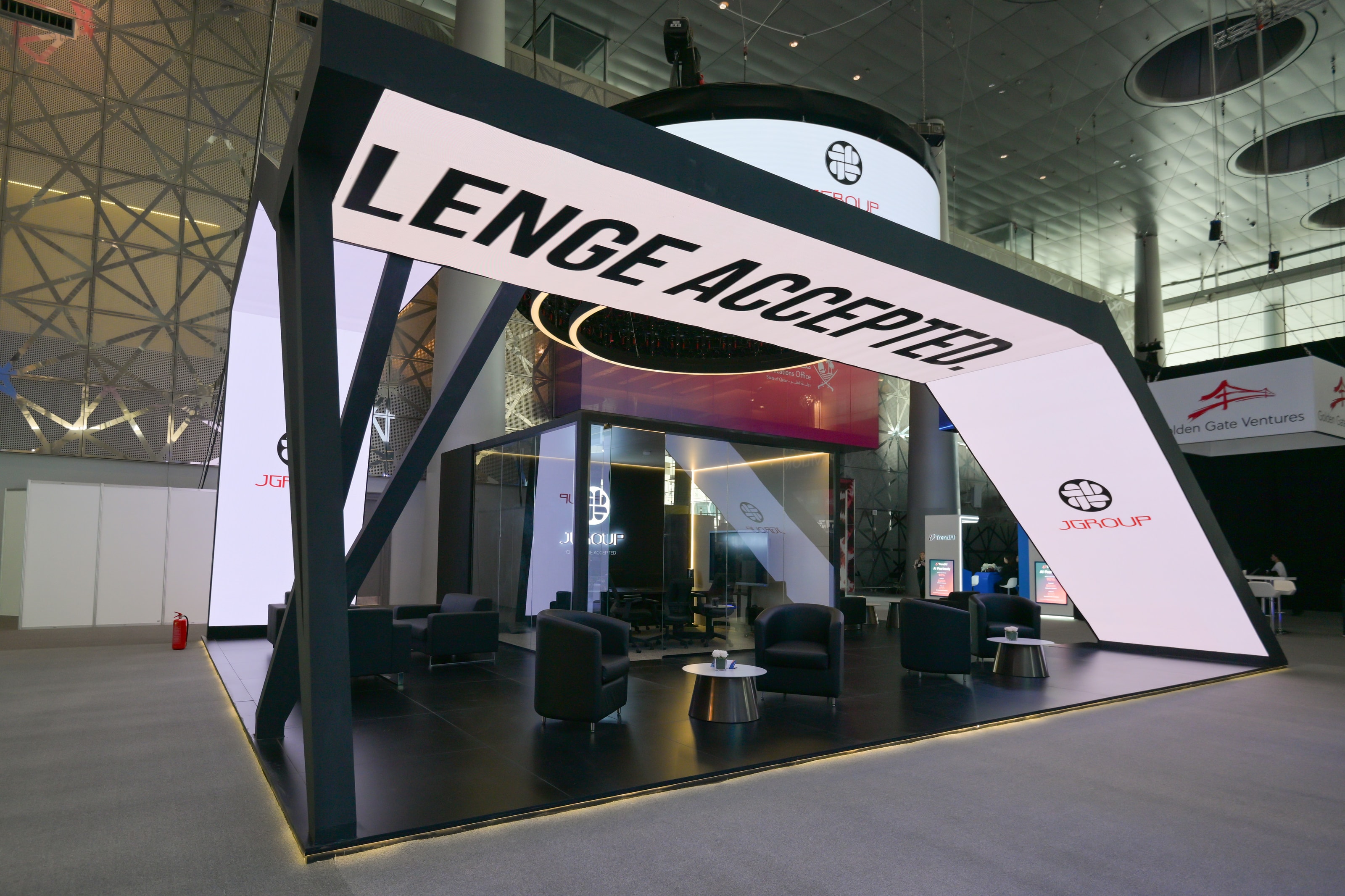 J Group stand at Web Summit with a sweeping “Challenge Accepted” light-box