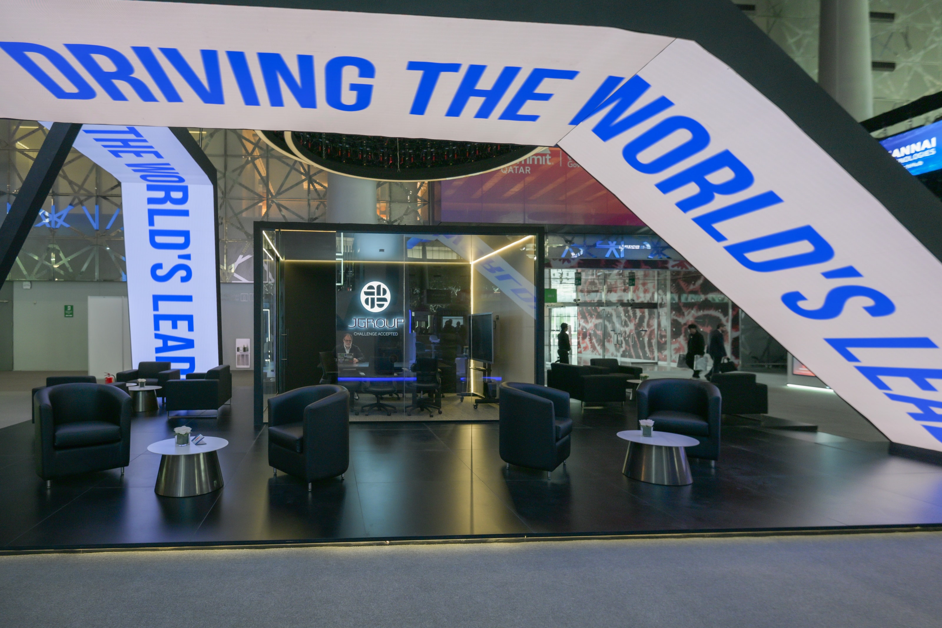 Angled light-box blade reading “Driving the world’s leading…”