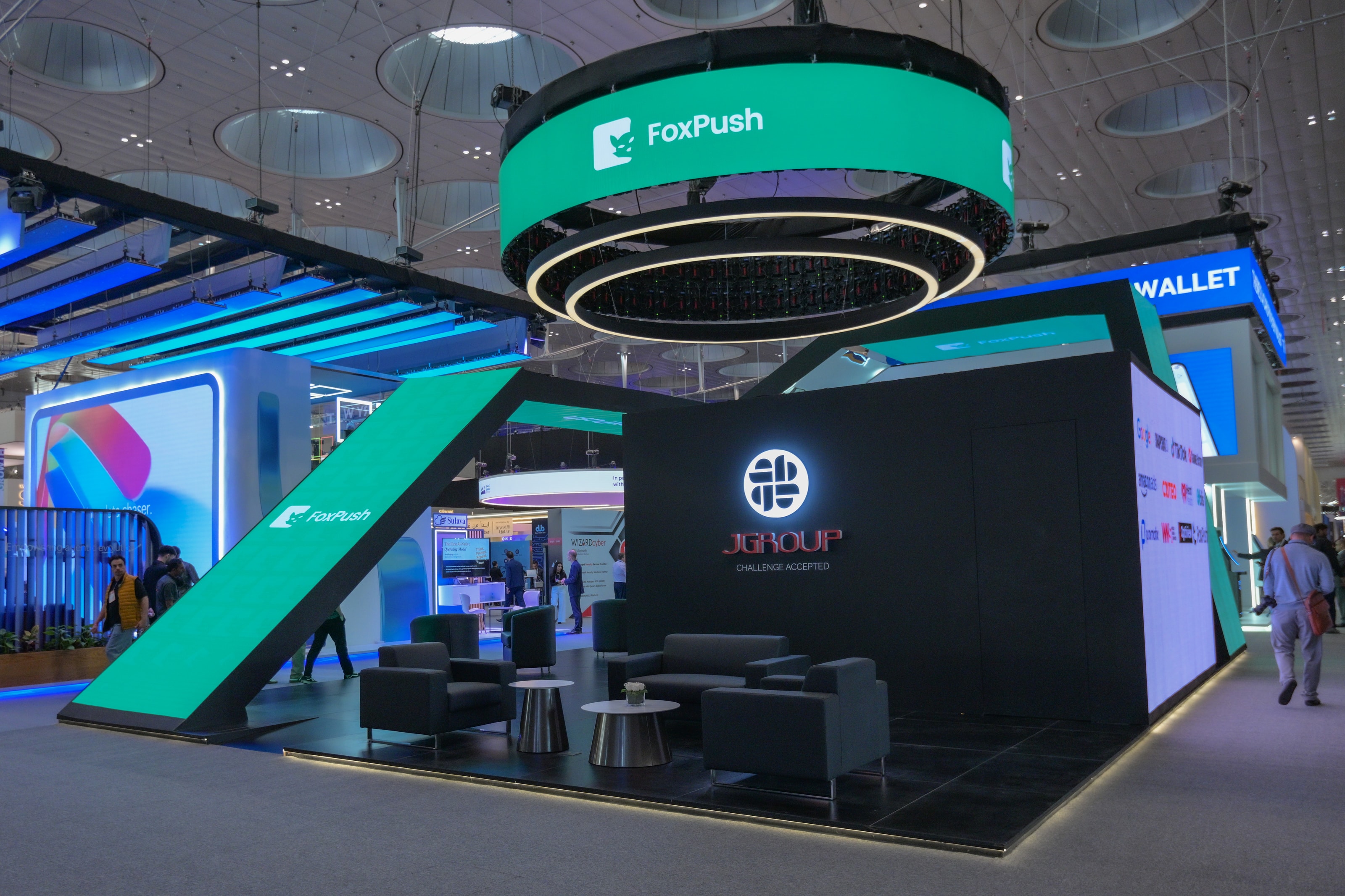 Partner halo sign in green above a lounge area