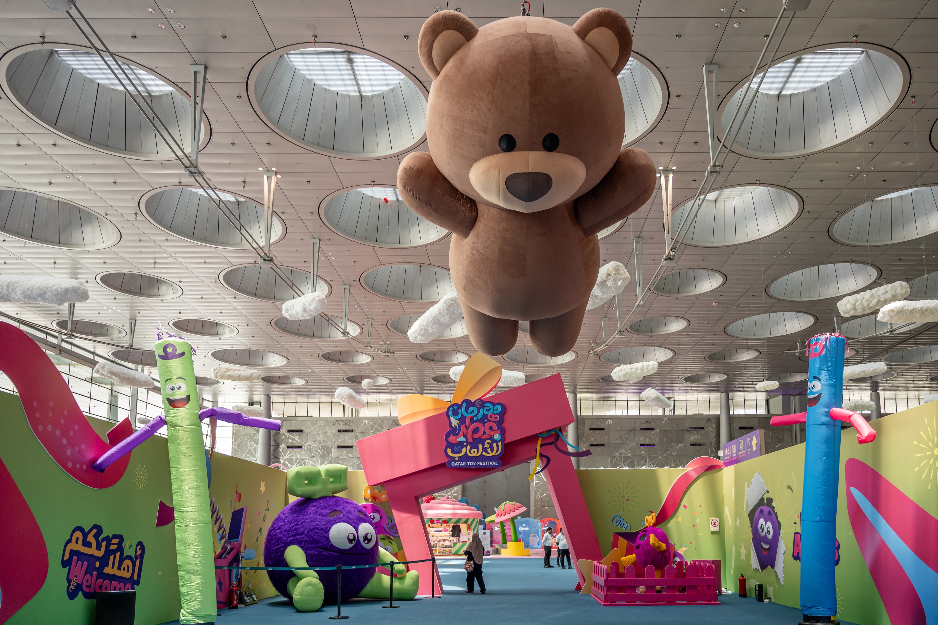 Giant teddy bear suspended above the festival floor