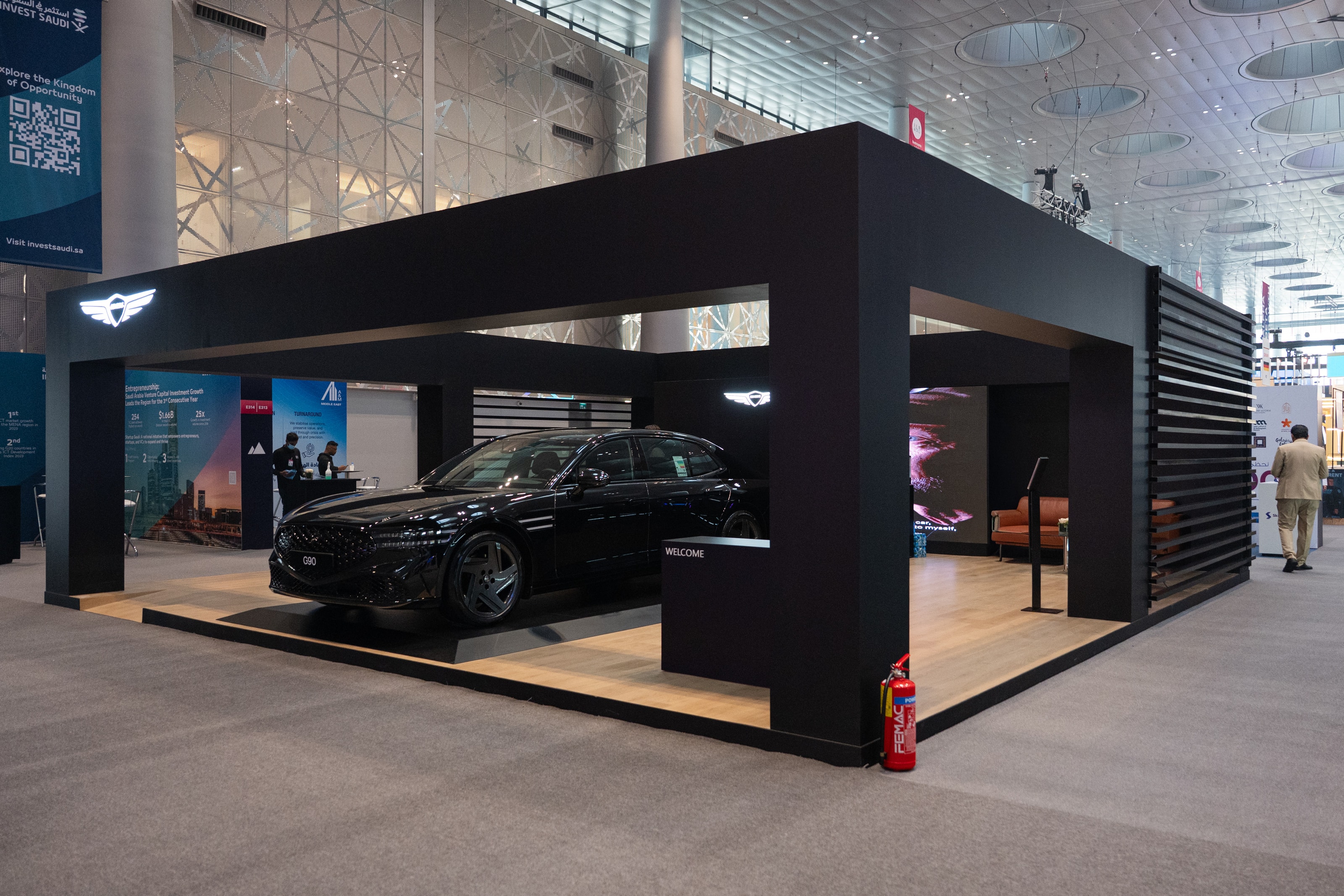 Genesis pavilion: a black canopy framing a G90 sedan